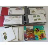 2 albums of First Day covers together with assorted reproduction transport postcards