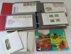 2 albums of First Day covers together with assorted reproduction transport postcards