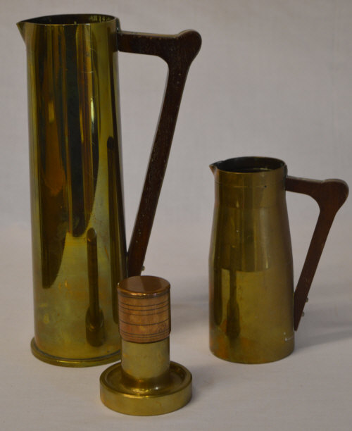 WWII era trench art jugs and a small brass table lighter