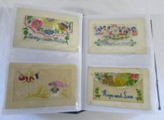 Postcard album containing approx 73 silk embroidered postcards and other cards relating to the war