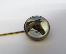 Tested as 15ct gold reverse crystal intaglio stick pin of a horse