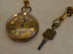 An ornate 14kt ladies pocket fob watch, the dial with Roman numerals and floral decoration,