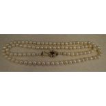 Natural pearl necklace with a 9ct gold star shaped clasp,