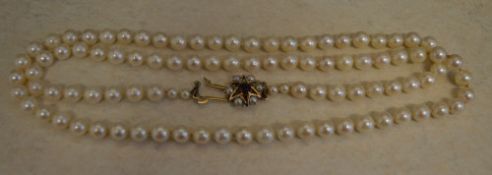 Natural pearl necklace with a 9ct gold star shaped clasp,