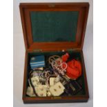 Good selection of costume jewellery in a vintage wooden box including earrings,