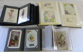 4 postcard albums containing mainly greeting cards