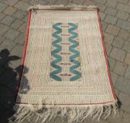 Green / cream rug,