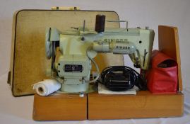 A cased Singer sewing machine