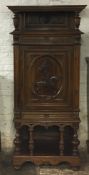 Large French ornate walnut cabinet with a carved Joan of Arc panel H182cm W77cm