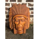 Carved wooden wall mask of a native Indian