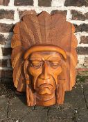 Carved wooden wall mask of a native Indian