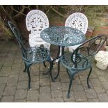 2 pairs of cast iron garden chairs & a table