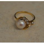 Tested as 18ct gold simulated diamond and pearl ring, total weight approx 2.