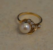 Tested as 18ct gold simulated diamond and pearl ring, total weight approx 2.