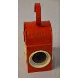 Red painted railway lamp,