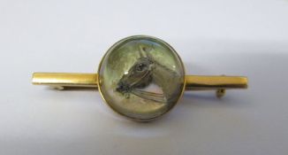 Tested as 15ct gold reverse crystal intaglio stick pin of a horse L 4 cm