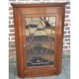 Georgian mahogany glass fronted corner cupboard with dental coarse to pelmet,