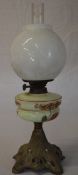 Oil lamp with a floral reservoir and white shade
