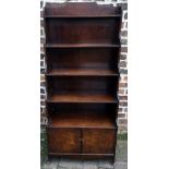 Regency style waterfall front mahogany bookcase