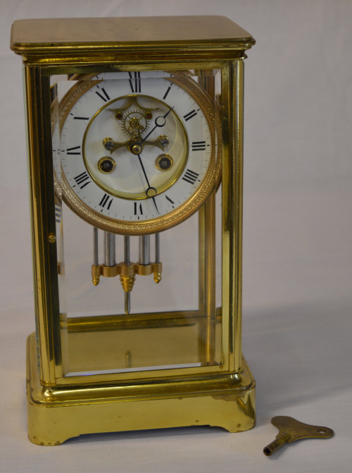 Brass four glass clock with twin mercury tube pendulum,