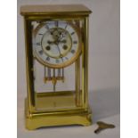 Brass four glass clock with twin mercury tube pendulum,
