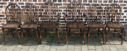 6 wheel back dining chairs including 2 carvers
