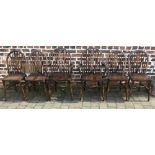 6 wheel back dining chairs including 2 carvers