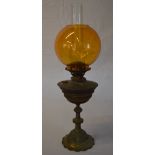 Oil lamp with an amber glass shade