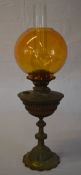 Oil lamp with an amber glass shade