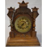 An Ansonia mantle clock with brass coloured dial