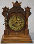 An Ansonia mantle clock with brass coloured dial