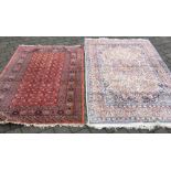 2 Persian style rugs with red & blue/ivory grounds.