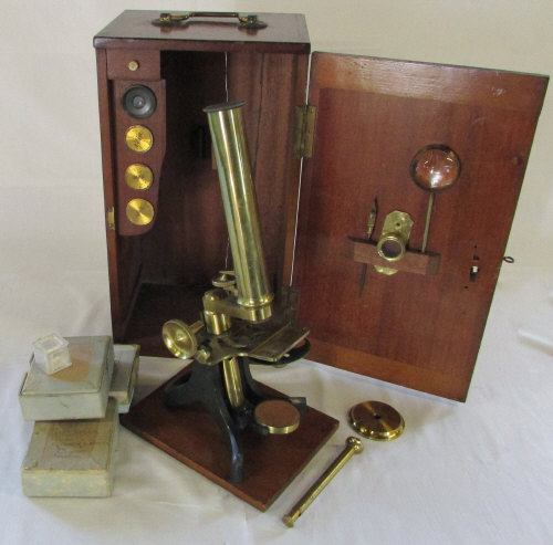 Victorian brass microscope in fitted wooden box with accessories