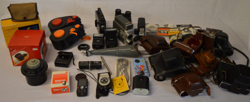 Quantity of photography accessories including flash units, camera cases,