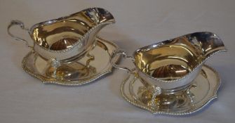 2 large silver sauce boats on three paw feet with lion head mounts London 1978 and 2 sauce boat