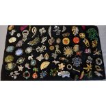 Large board of mixed costume jewellery brooches