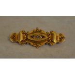 An Edwardian 15ct gold diamond and ruby bar brooch, Chester 1903, total approx weight 4.