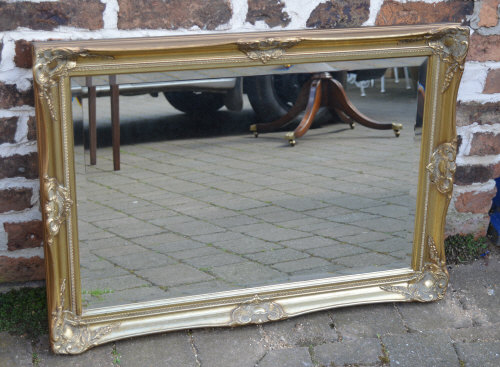 Ornate gilt wall mirror