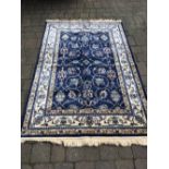 Blue ground cashmere rug with all over zieglar design 200cm by 130cm