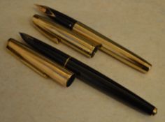 Parker 61 fountain pen with a gold filled cap and a Sheaffer fountain pen with a 14k gold nib