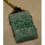 Ornate pinchbeck plaque drop pendant on a yellow metal chain depicting an Oriental pagoda scene in