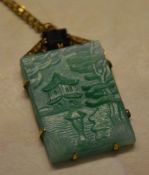 Ornate pinchbeck plaque drop pendant on a yellow metal chain depicting an Oriental pagoda scene in