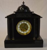 Late 19th century black slate mantle clock of classical form with Corinthian columns