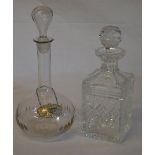 2 decanters and a silver Sherry bottle label