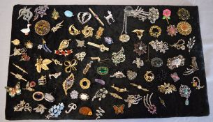 Large board of mixed costume jewellery brooches