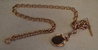 A heavy 9ct gold large link watch chain with T bar and bloodstone/carnelian swivel fob,
