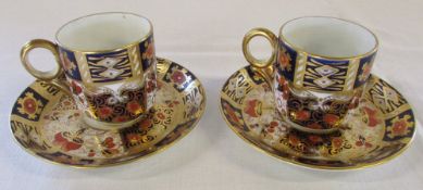 Pair of Imari coffee cups and saucers pattern no 2614 crown mark to underside