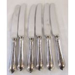 6 silver handled knives L 24.