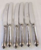 6 silver handled knives L 24.