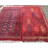 2 red ground Persian style rugs.